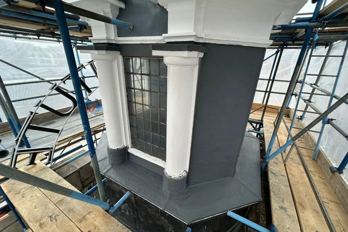 Twin Doric columns flanking leaded-light window with painted pediment and fresh lead roof sheet — O2 Institute Birmingham